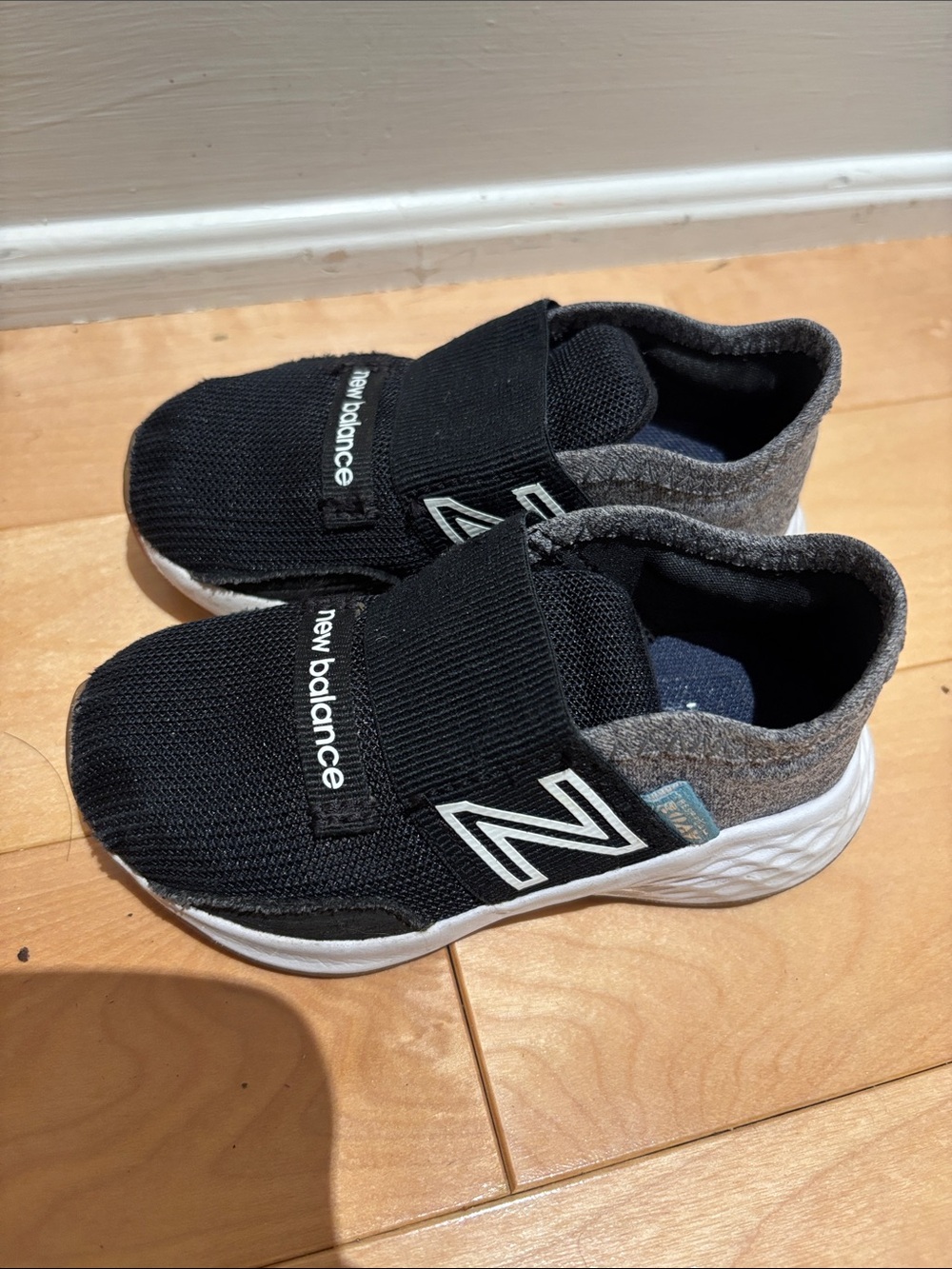 Size 6 New Balance Kids Black and Gray Slip-On Sneakers